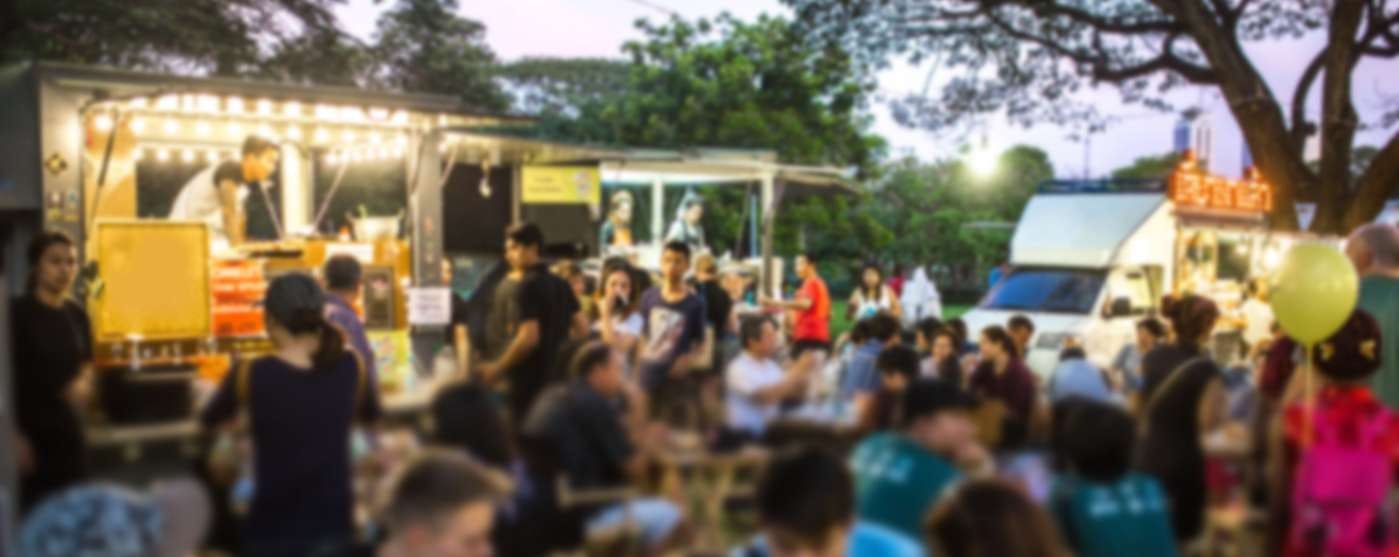 People eating at a food truck